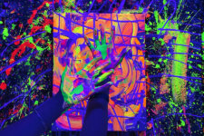 Splatter Studio LA fluorescent | Santa Monica Sun Hands covered in neon purple, green, and pink paint press onto a swirled orange canvas in a vivid abstract painting scene, with splatters around.