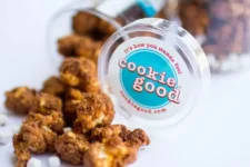 Cookies spilled from a jar labeled 'cookie good' with the slogan 'It's how you wanna feel' visible in the foreground.