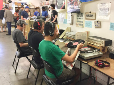 Record Surplus customers sample vinyl albums