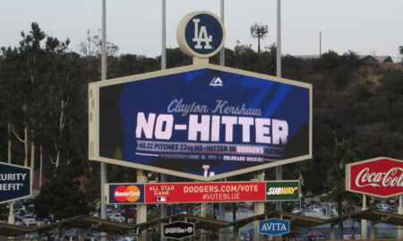 Large scoreboard at a Dodgers stadium displaying the word 'NO-HITTER' in bold letters, with 'Clayton Kershaw' above and Dodgers branding nearby.