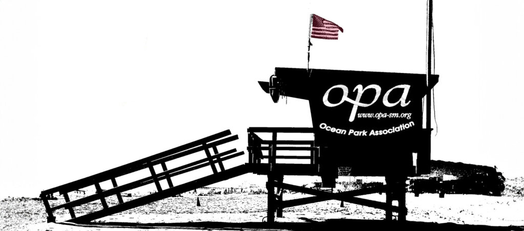 Lifeguard tower silhouette on a beach, with a slanted ramp and an American flag, displaying the opa Ocean Park Association logo on the side.