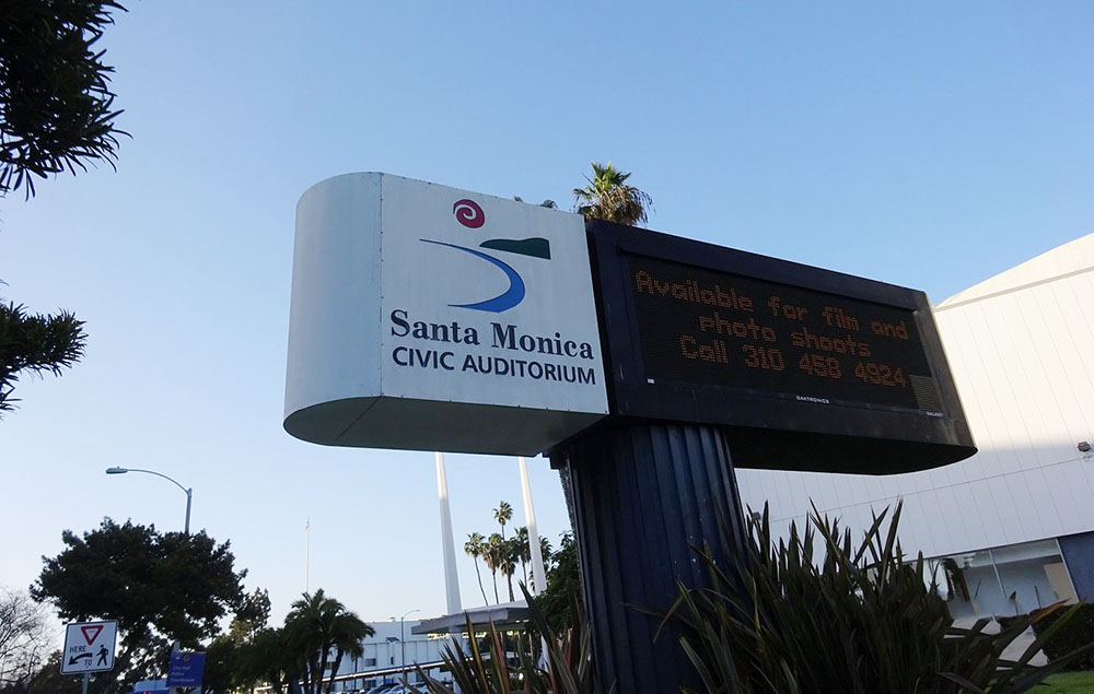 Sign for Santa Monica Civic Auditorium with a digital marquee advertising: 'Available for film and photo shoots'