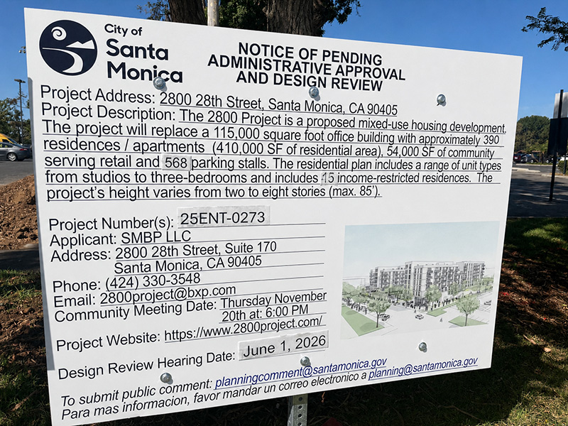 Large city sign for Santa Monica announces a pending administrative approval and design review for a mixed-use project, with address and project details visible at left and a small rendering image at right.