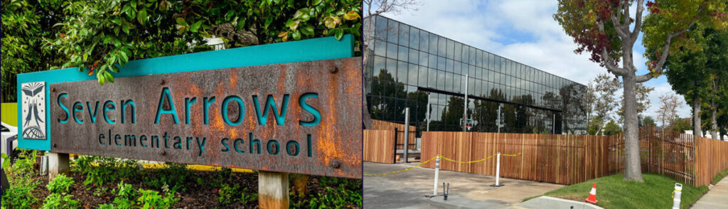 Rust-colored Seven Arrows Elementary School sign with greenery, and a modern glass-front building with a wooden fence nearby on campus.